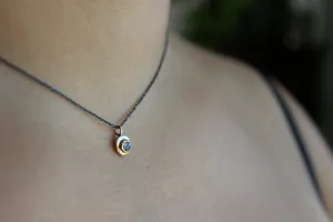 Blue Tanzanite gold pendant with oxidized sterling silver chain