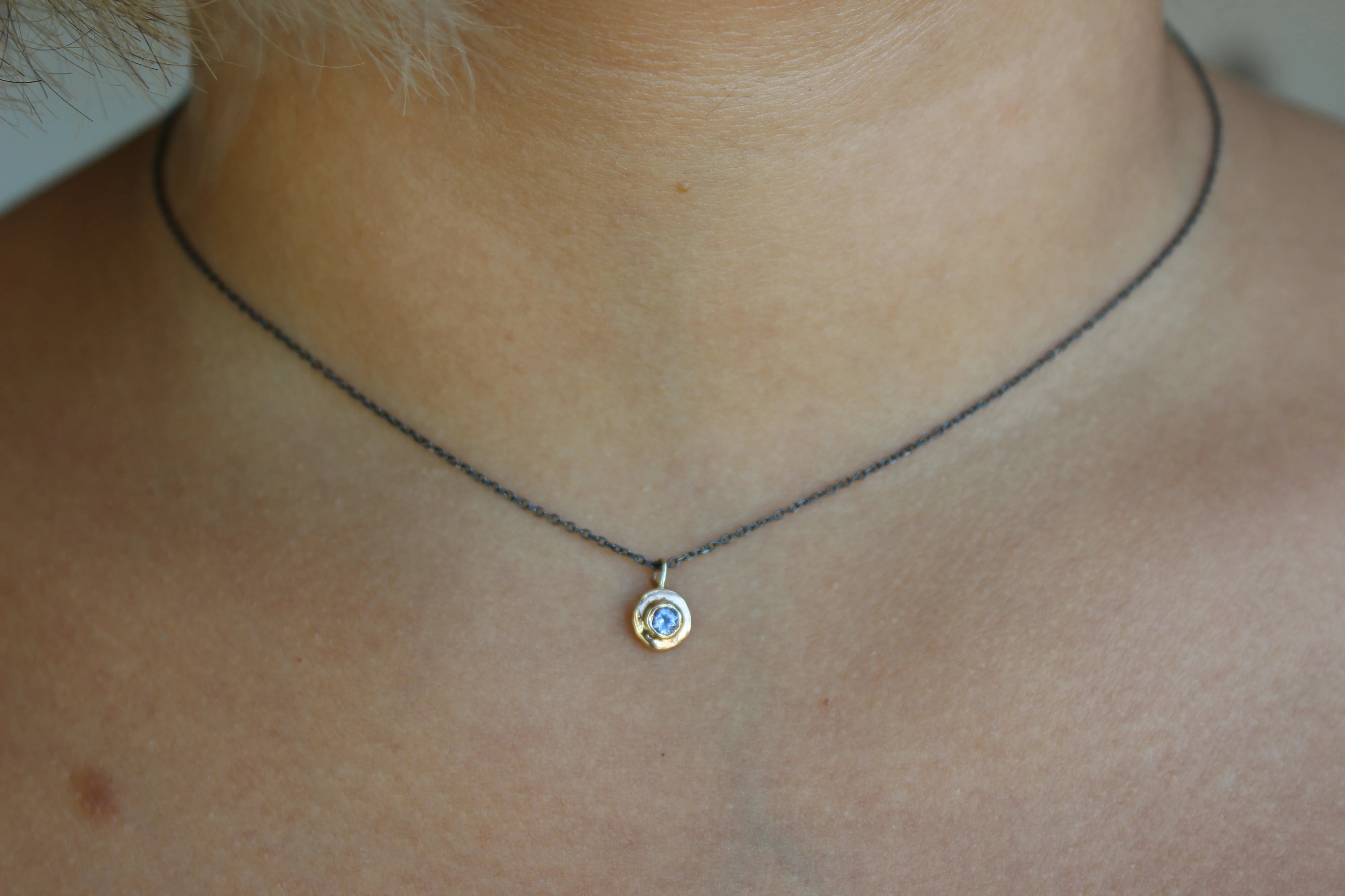 Blue Tanzanite gold pendant with oxidized sterling silver chain