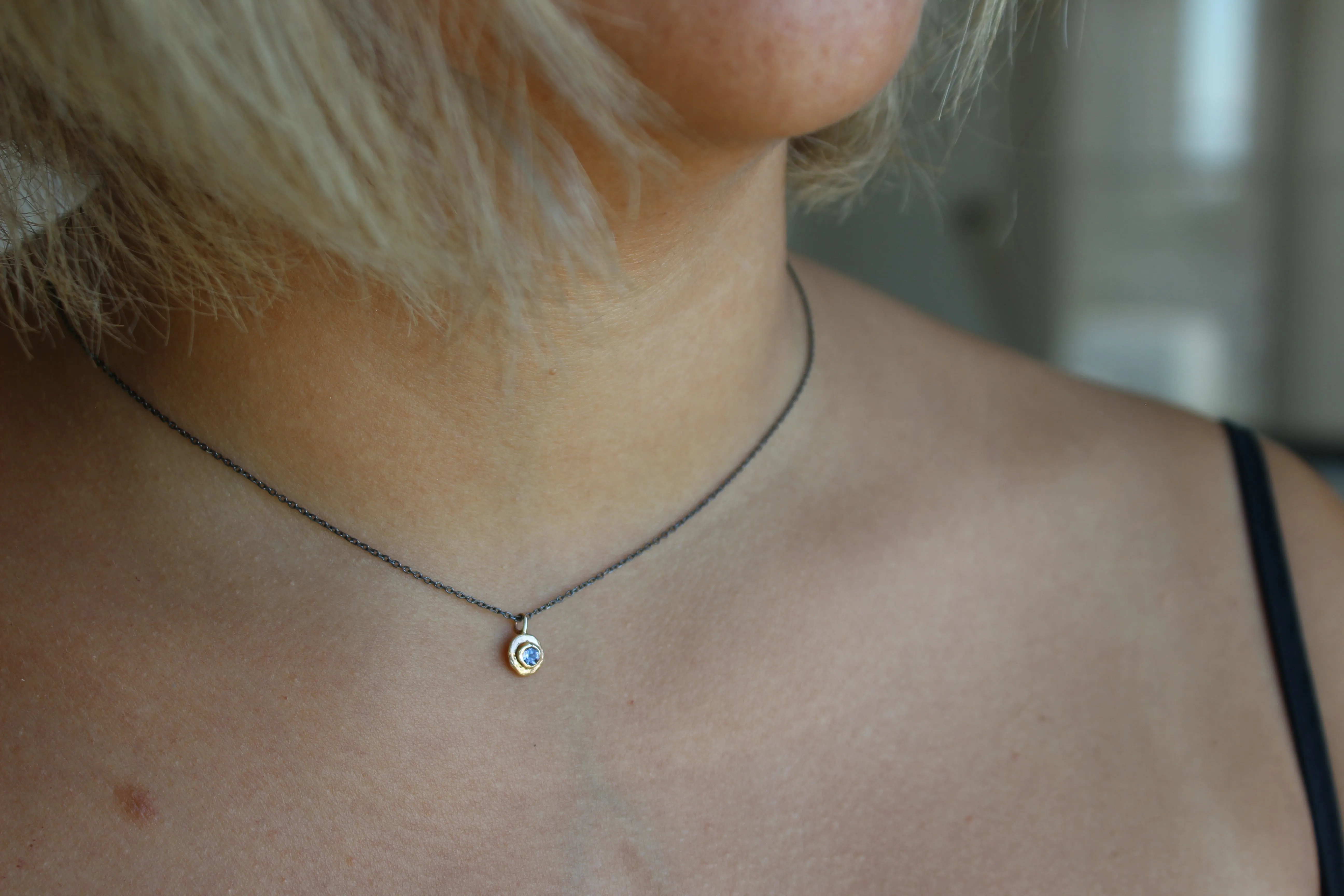 Blue Tanzanite gold pendant with oxidized sterling silver chain