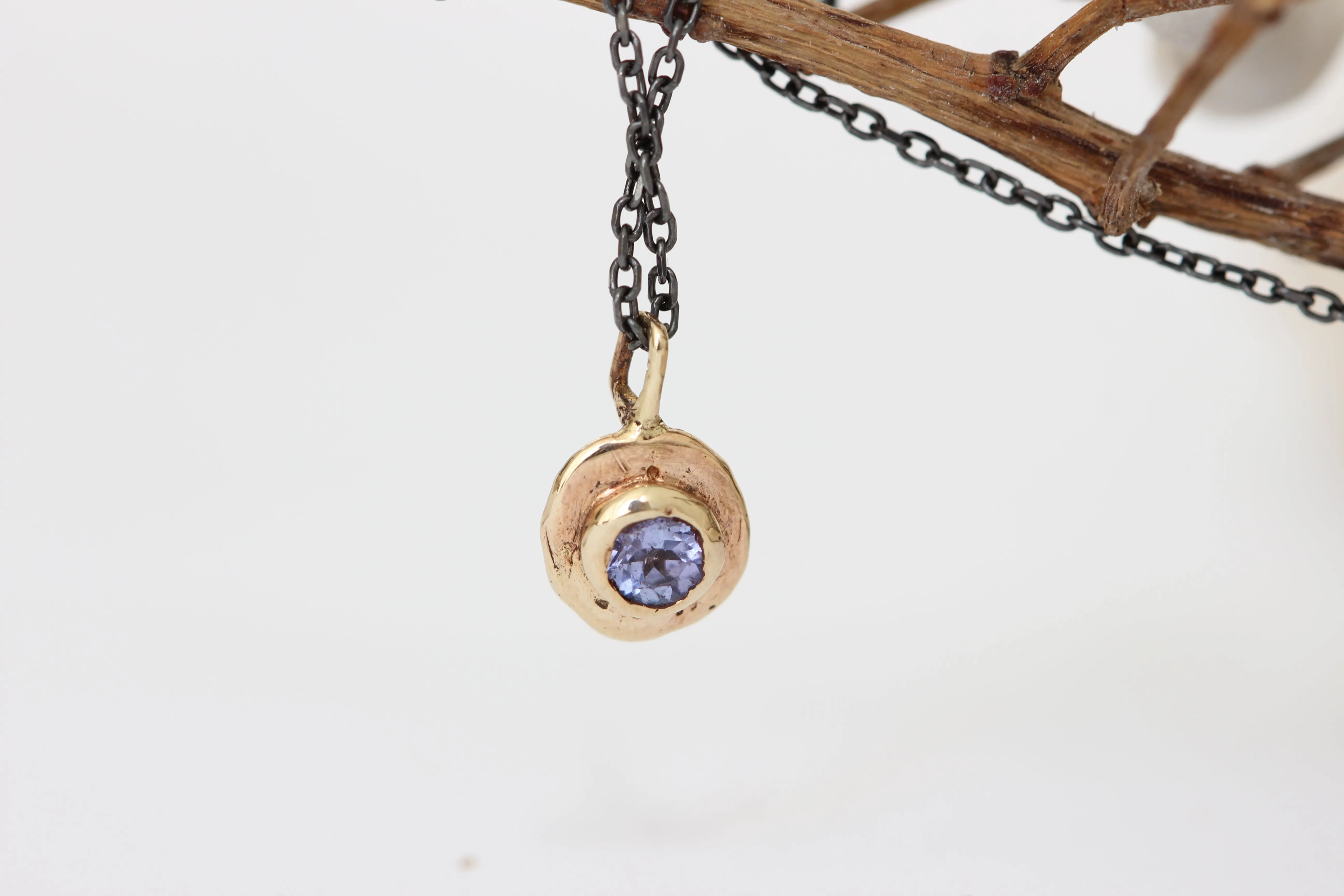 Blue Tanzanite gold pendant with oxidized sterling silver chain