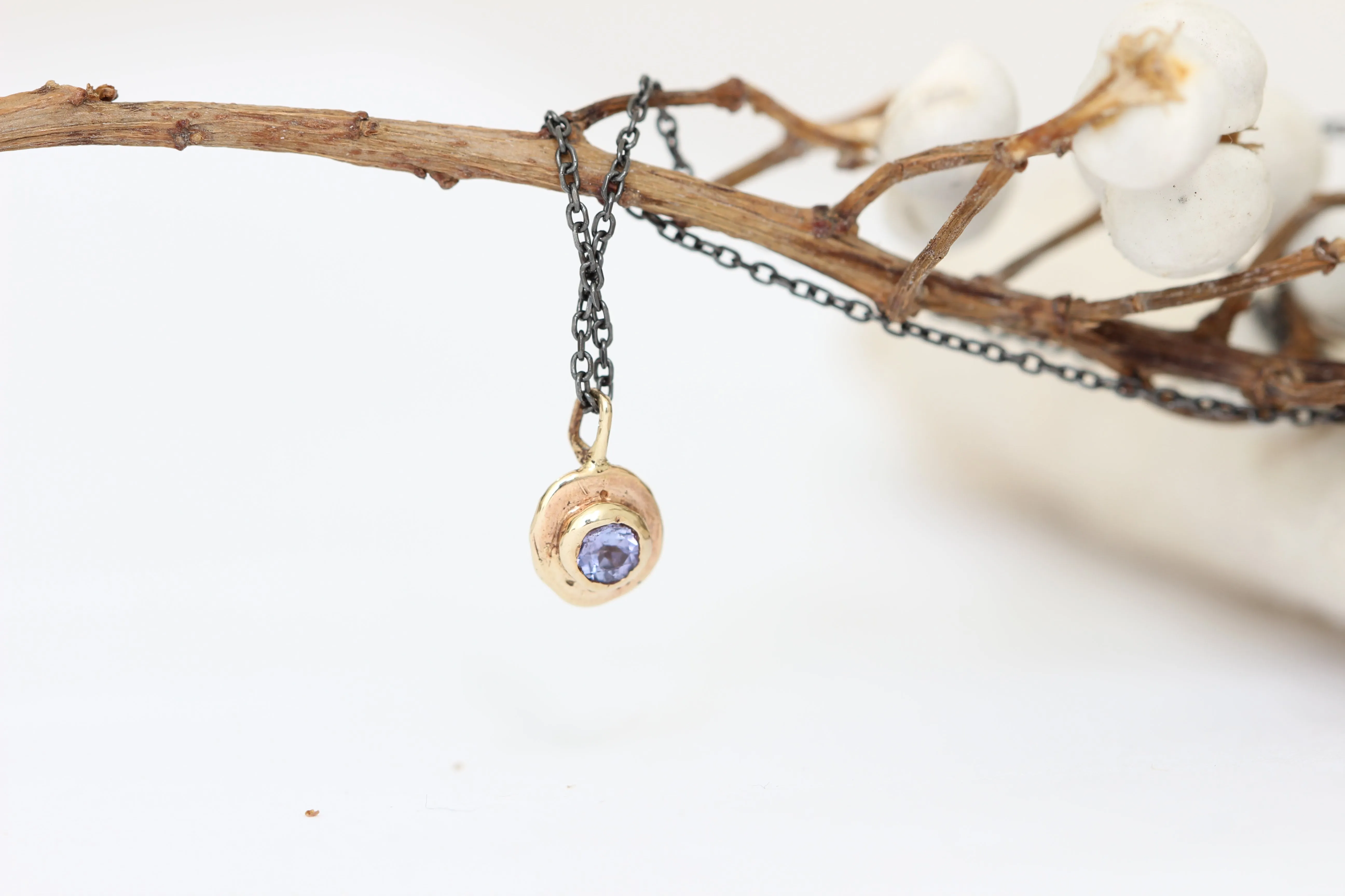Blue Tanzanite gold pendant with oxidized sterling silver chain