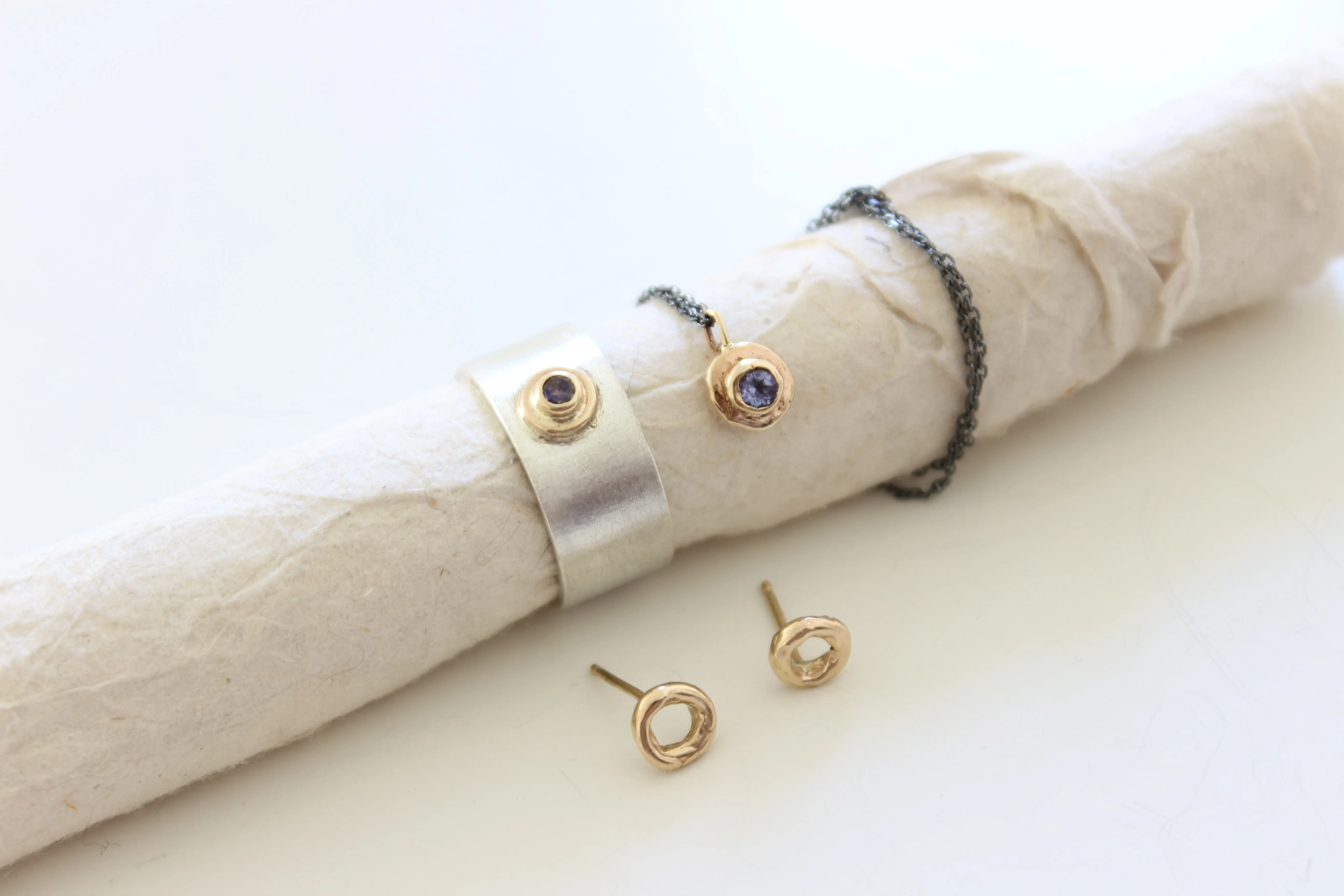 Blue Tanzanite gold pendant with oxidized sterling silver chain